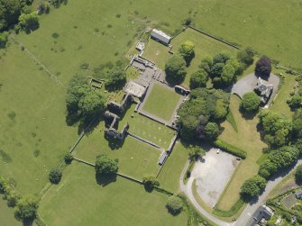 Oblique aerial view of Dundrennan Abbey, taken from the NNW.