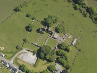 Oblique aerial view of Dundrennan Abbey, taken from the W.
