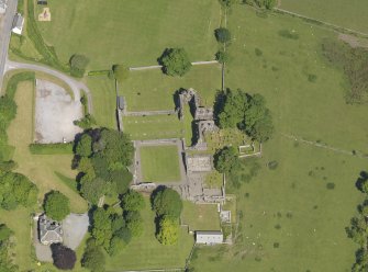 Oblique aerial view of Dundrennan Abbey, taken from the SSW.