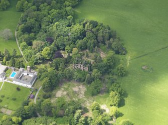 Oblique aerial view of Gelston Castle and policies, taken from the SE.