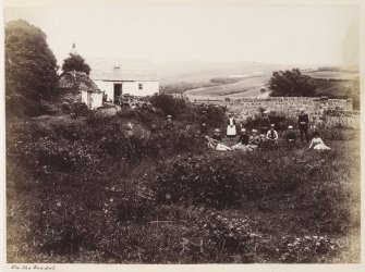 View of bridge and cottage with a group of people in the foreground.  
Titled: 'On the Lendal'. 

