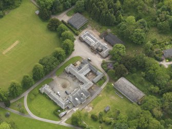 Oblique aerial view of Kinmount House stables, taken from the NNE.