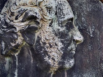 Detail of portrait sculpture on monument in memory of John Anthony MaCrea Esq. Located at St. Cuthbert's Cemetery.