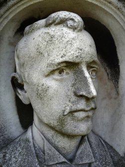 Detail of portrait sculpture on monument in memory of William Gibson. Located at the north east corner of Rosebank Cemetry.