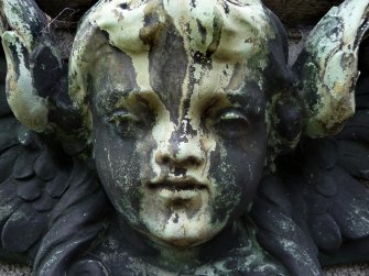 Detail of sculpture on monument in memory of Eva St. Clair Leitch. Located at the Grange Cemetery.