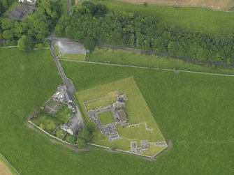 Oblique aerial view of Glenluce Abbey, taken from the SW.