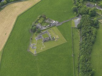 Oblique aerial view of Glenluce Abbey, taken from the SE.
