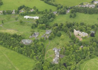 Oblique aerial view of Birkwood House and policies, taken from the SE.