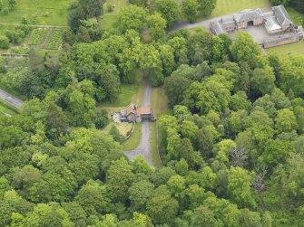 Oblique aerial view of Sorn Castle upper gate lodge and stables, taken from the NW.