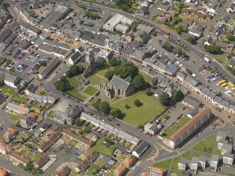 General oblique aerial view of Kilwinning Abbey, taken from the SE.