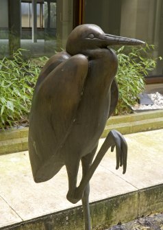 Detail of heron sculpture in lower ground floor pool of atrium