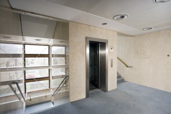 Interior. View of NE stairwell landing at 1st floor, taken from WNW