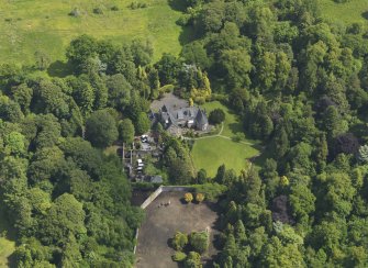 Oblique aerial view of Treesbank House and stables, taken from the W.