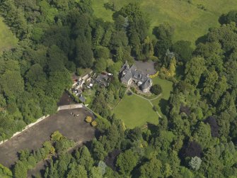 Oblique aerial view of Treesbank House and stables, taken from the SW.