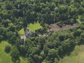 Oblique aerial view of Treesbank House and stables, taken from the NNW.