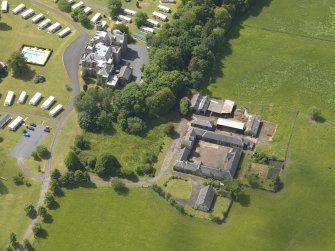 Oblique aerial view of Dankeith House and stables, taken from the NNE.