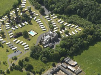Oblique aerial view of Dankeith House and stables, taken from the NNW.
