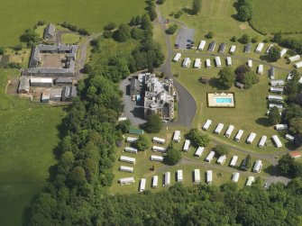 Oblique aerial view of Dankeith House and stables, taken from the SW.