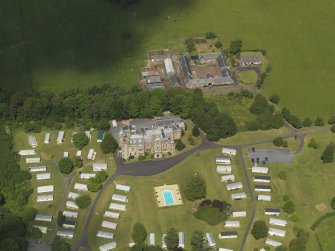Oblique aerial view of Dankeith House and stables, taken from the SE.