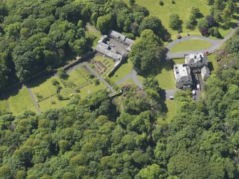 Oblique aerial view of Hillhouse and stables, taken from the NE.
