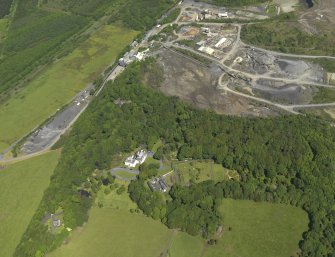 General oblique aerial view of Hillhouse with the Whinstone quarry adjacent, taken from the S.