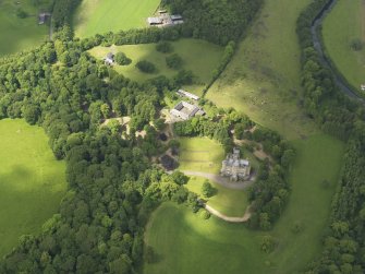 Oblique aerial view of Caprington Castle and stables, taken from the ESE.