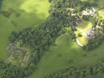 Oblique aerial view of Caprington Castle and policies, taken from the ENE.