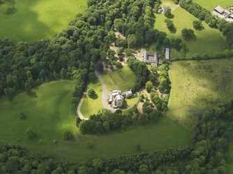 Oblique aerial view of Caprington Castle and stables, taken from the NNE.