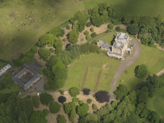 Oblique aerial view of Caprington Castle and stables, taken from the S.