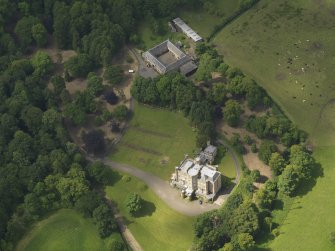 Oblique aerial view of Caprington Castle and stables, taken from the E.