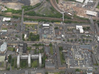 Oblique aerial view centred on Rutherglen High Street, taken from the S.