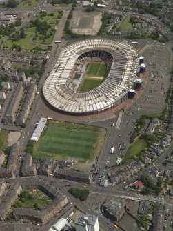 Oblique aerial view centred on the football stadium, taken from the WSW.