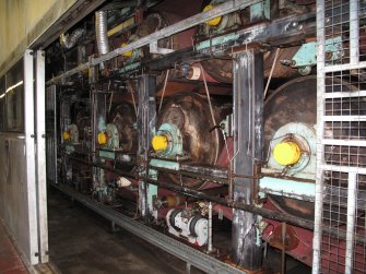 Interior. Building 18.  No.6 Paper Machine. Rolls of No.6 Paper Making Machine.