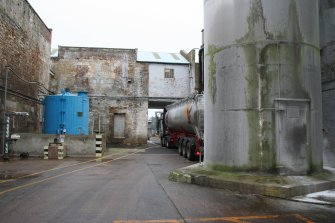 General view. West Yard (Central) looking north. Blue Sodium Hypo silo on left, Building 10 (former Rag Store) centre, starch silo on right.