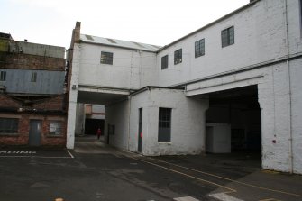 View. West Yard (North): view looking south under Building (6) towards Starch Silo; Northern Railway Access on right.