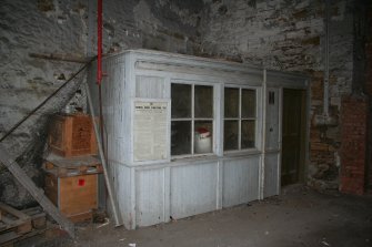 View. Southern Railway Access. Bothy in corner of Building (4) [left] and Main Street curtain wall [right]; view looking south west.