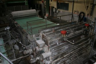 Interior. Building 18, ground floor. Flow box and wire of Paper Machine No. 6