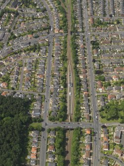 Oblique aerial view centred on the railway station, taken from the E.