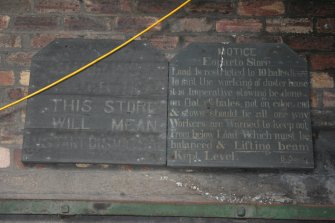 Electrical Cable Store (NO45132 19561) at N end of building 1 (Wood Pulp Storage Sheds). View of notice on Cable Store wall at northern entrance to Pulp Store.