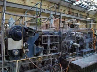 Interior. Building 19, No. 3 Paper Machine House, dandy roll to right, first press and couch roll to left (perforated).