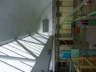 Interior. Building 7, Finishing Department:, adjacent to former Calender House (Building 6). View of fine roof construction.