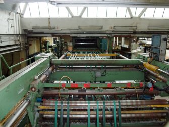 Interior. Building 7, Finishing Department:, adjacent to former Calender House (Building 6). View of partly dismantled sheeting machine.