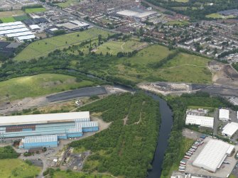 Oblique aerial view centred on the steel works, taken from the SSE.