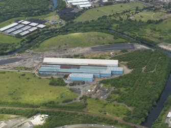 Oblique aerial view centred on the steel works, taken from the SSE.