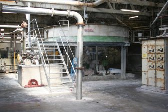 Interior. Building 2, Stock Preparation House, first floor. View showing Fibre Recovery Tank in northeast corner.