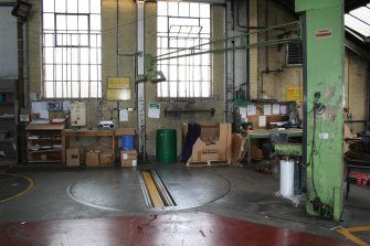Interior. Building 6, former Calender House, latterly Finishing Department. View showing Stretch Wrap Machine.