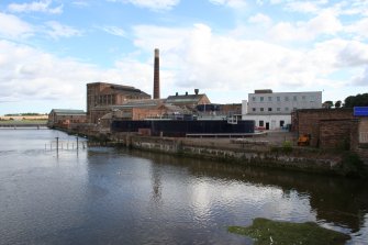 General view of mill taken from road bridge over Moonzie Burn looking south. Effluent Plant in foreground.