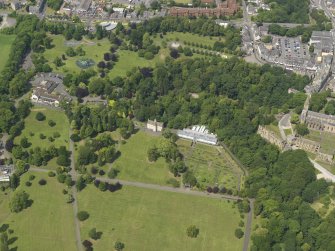 Oblique aerial view centred on the public park with the pavilions adjacent, taken from the S.