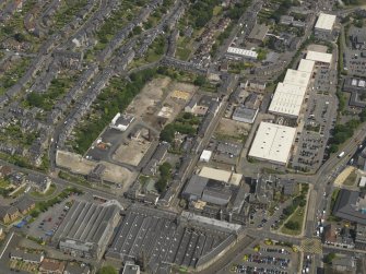 Oblique aerial view centred on the remains of the works, taken from the WSW.