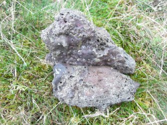 Example of vitrified rock found in the debris below the outermost timber-laced wall on the South side of the fort.